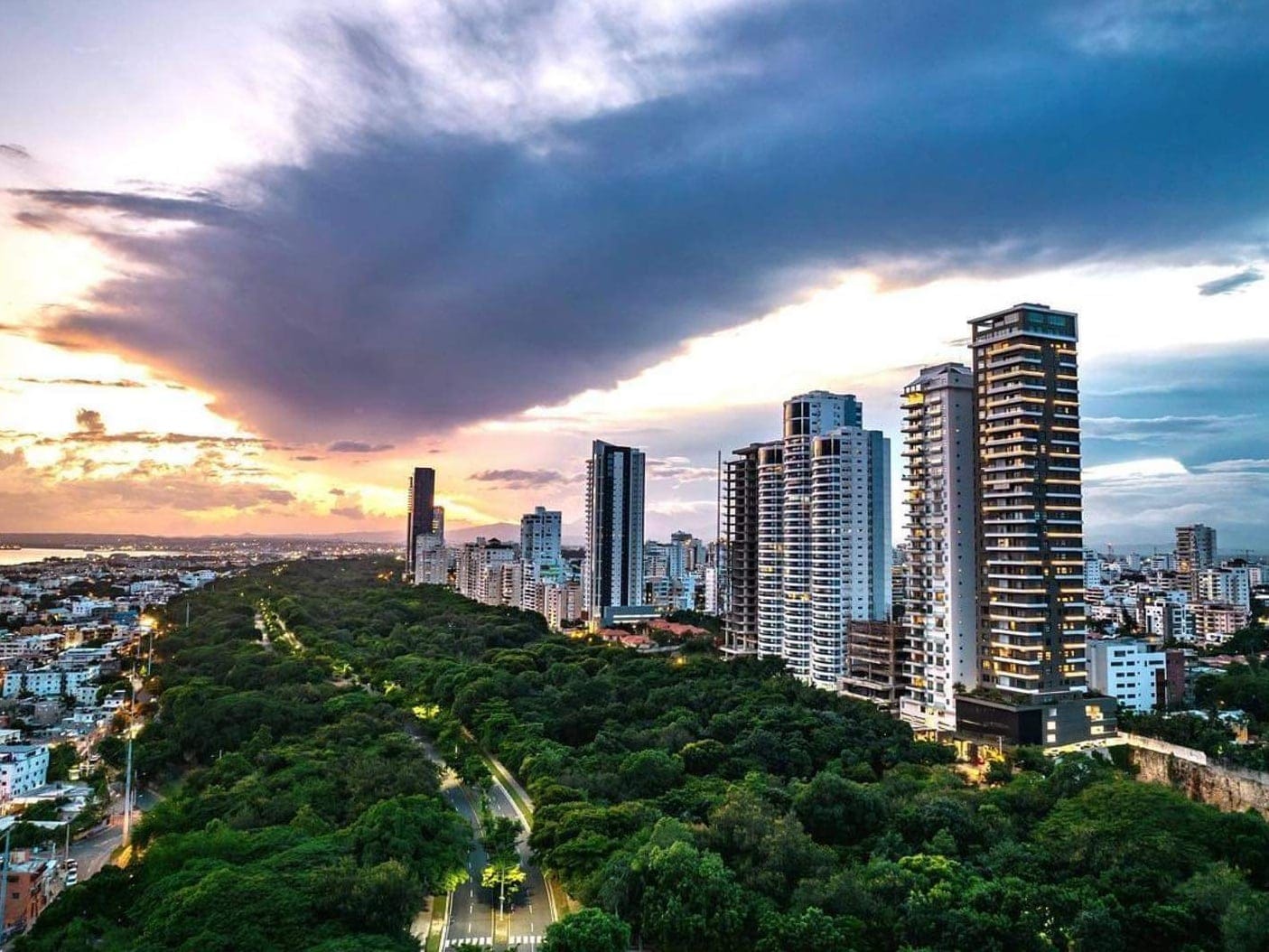 Sunset over Los Cacicazgos skyscrapers and park
