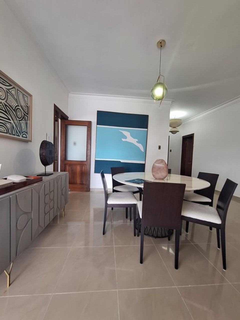 Elegant dining room with art